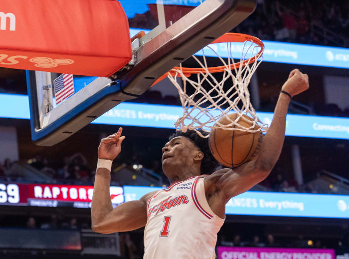 Rockets forward Amen Thompson dunks against the Toronto Raptors in the third quarter at Toyota Center.